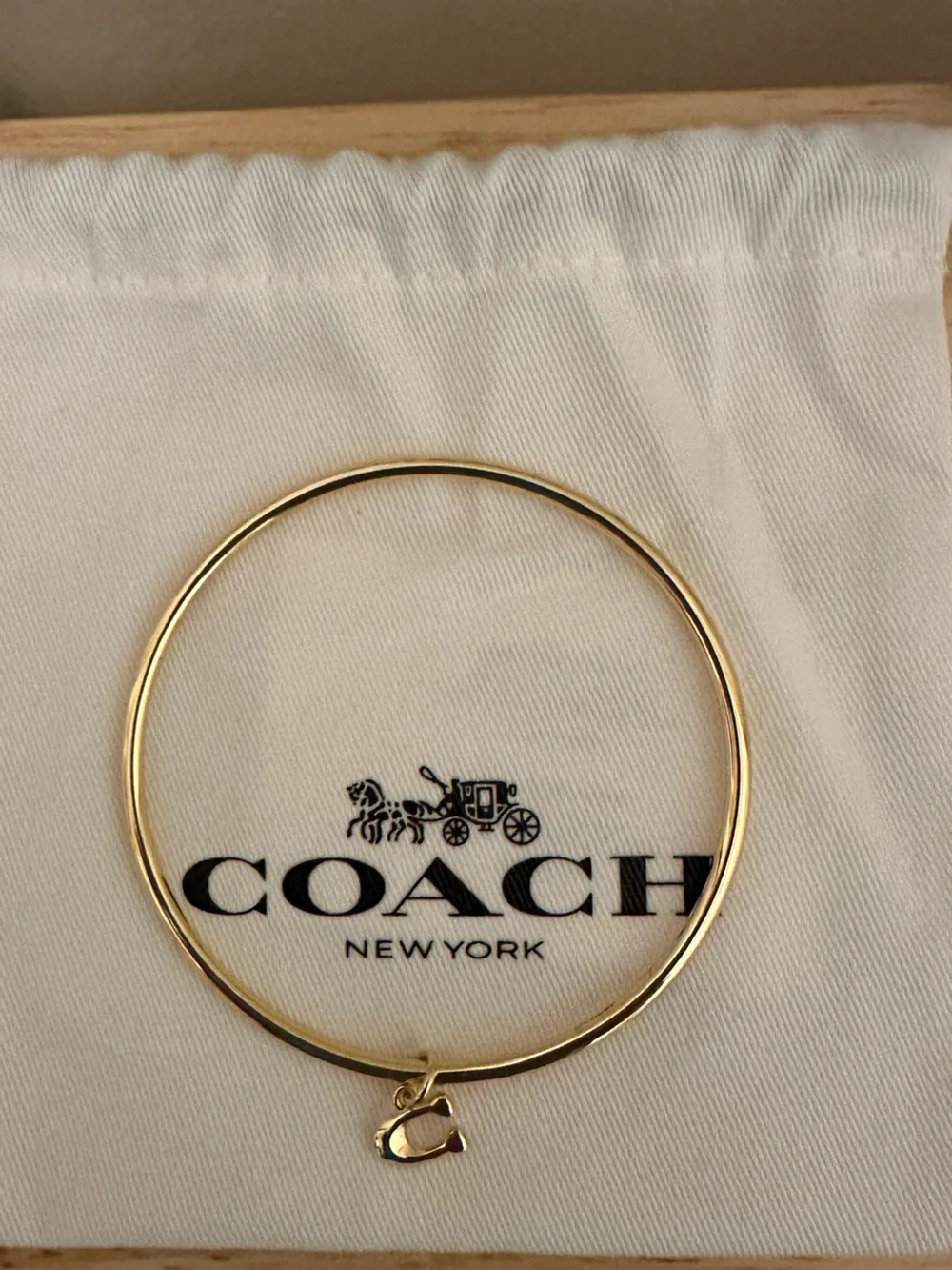 Coach polished gold